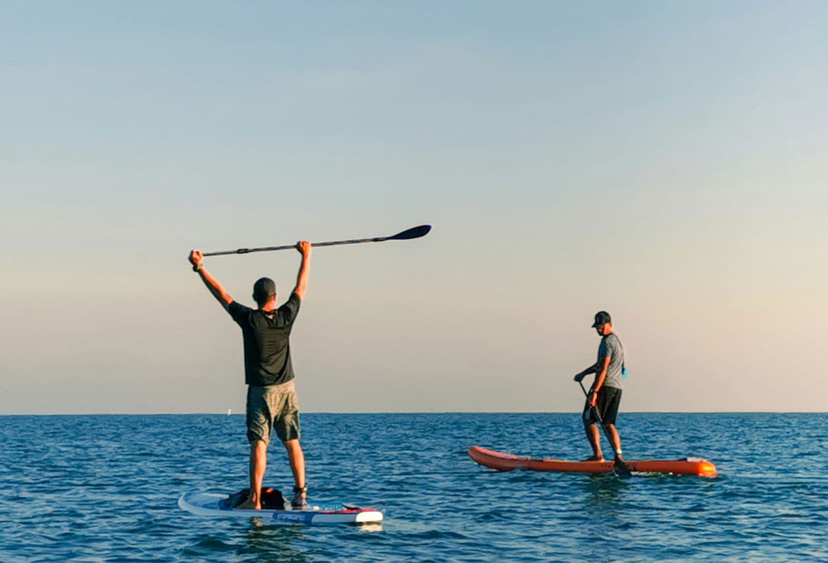 Do stand-up paddle boarding in Matilda Bay